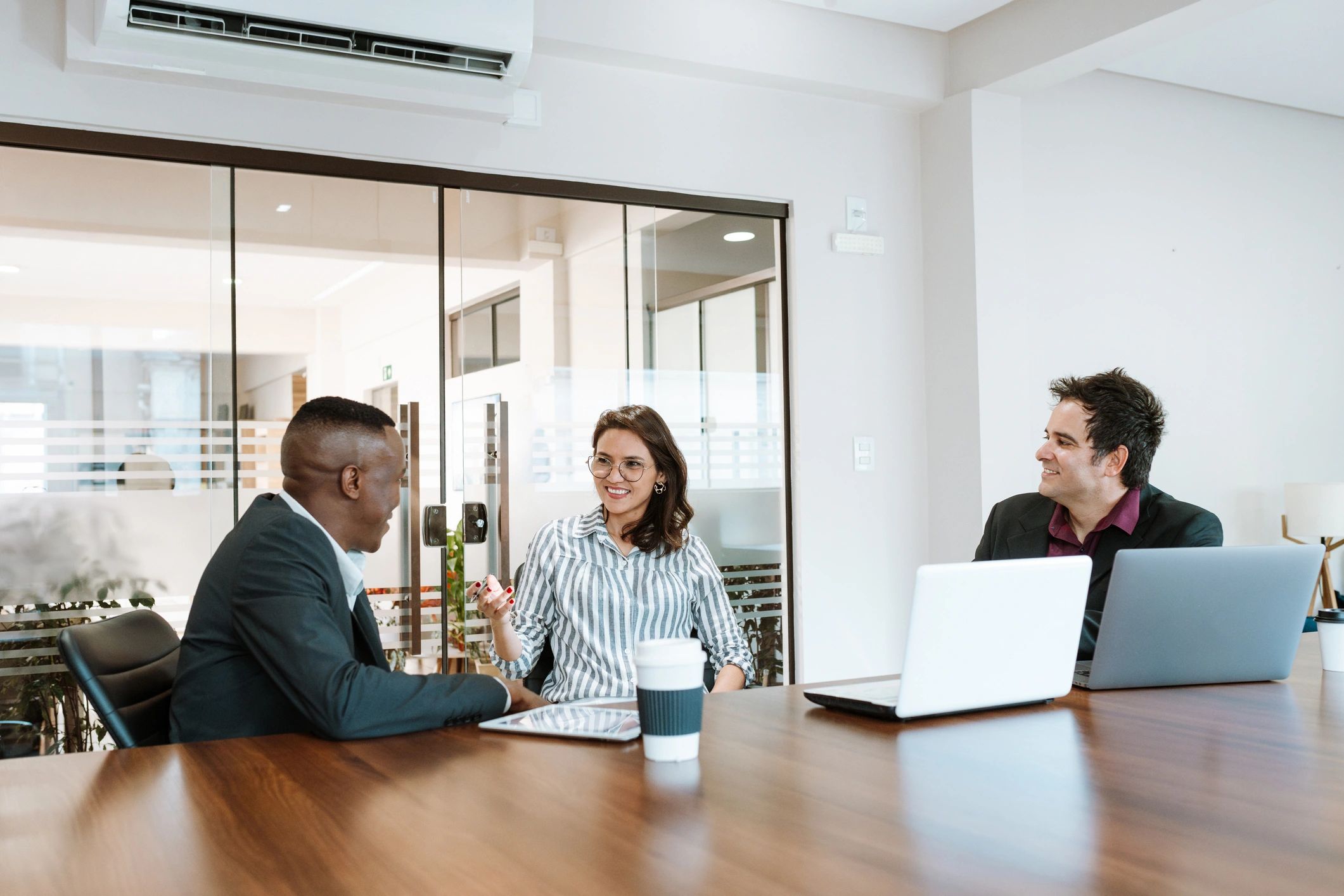 Business professionals in a collaborative meeting room